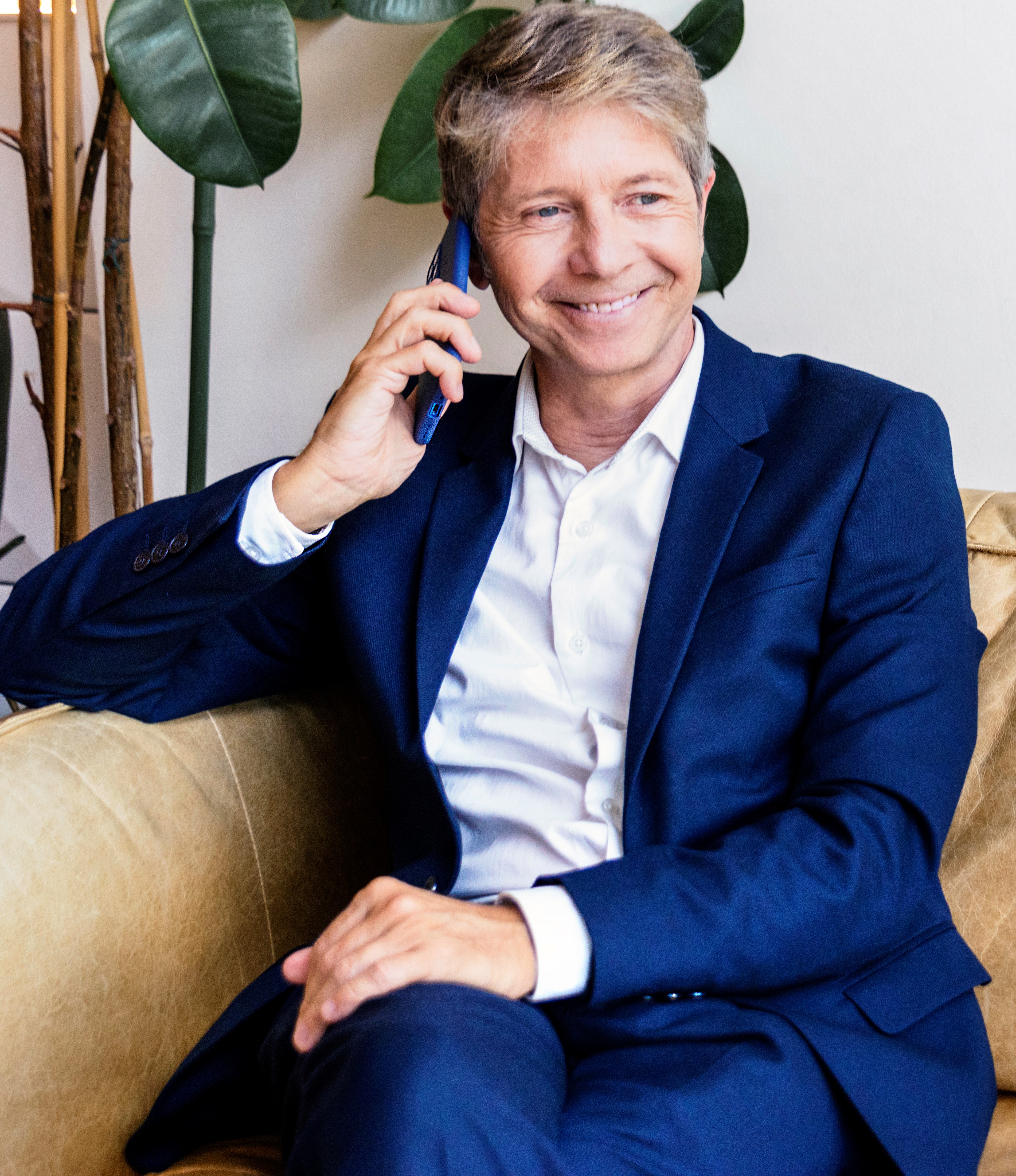 Smiling executive making a phone call